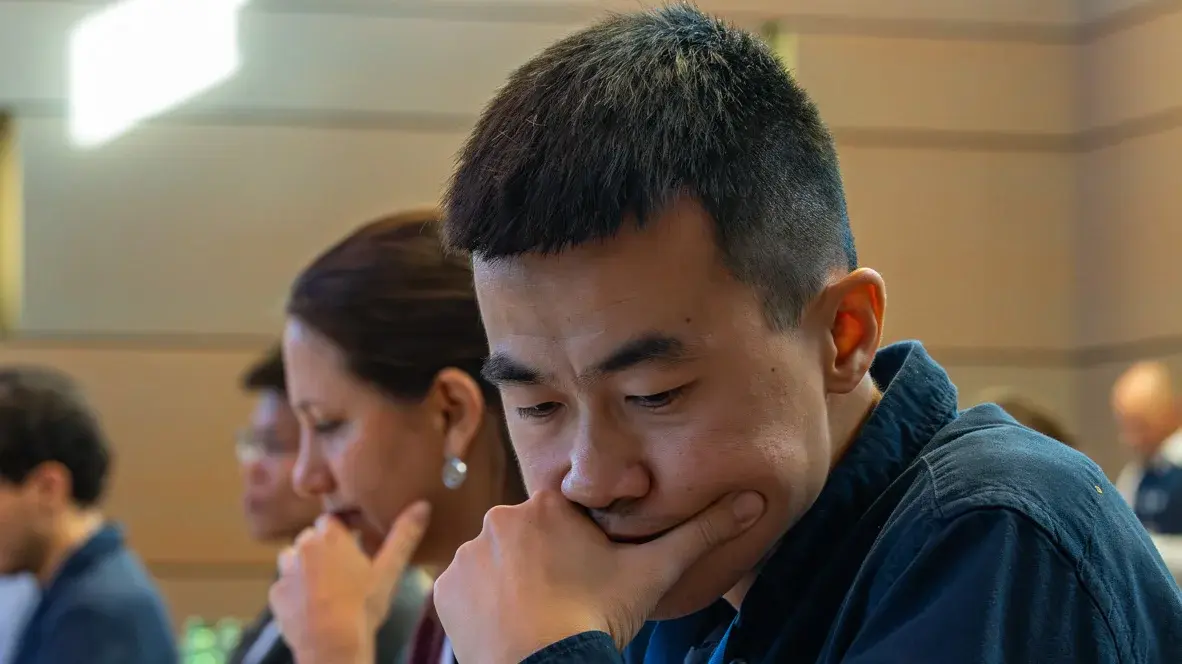 Professor Chen in front of his laptop