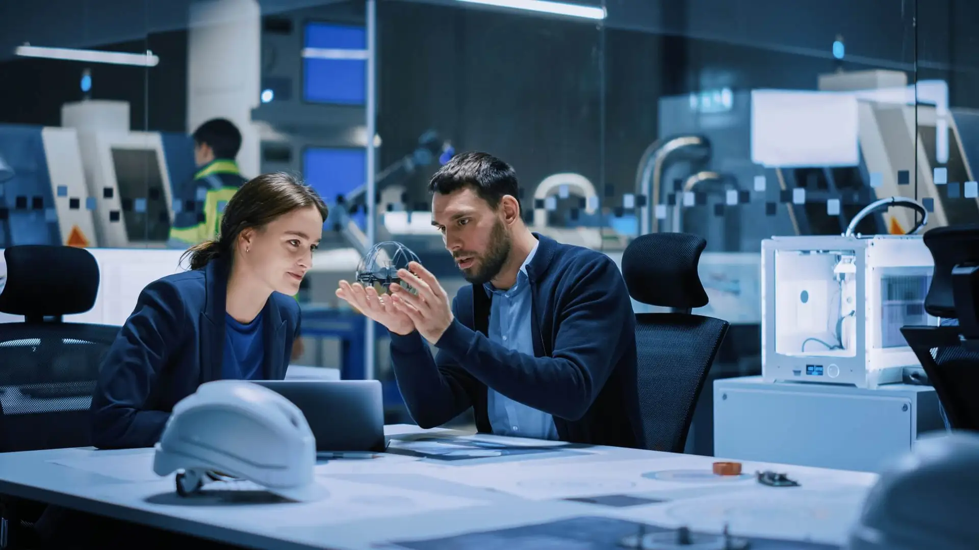 Two people discussing at a table