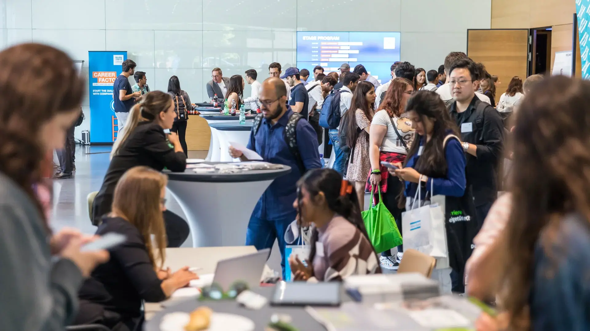 Students networking and eating at an event