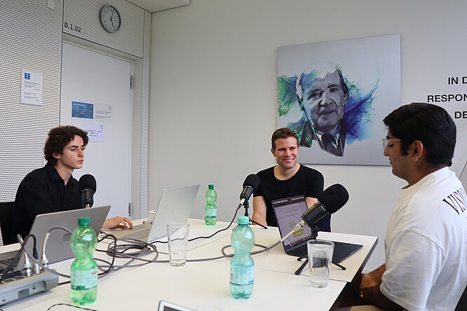 Dr. Felix Brych giving an interview to two students in a podcast at TUM Campus Heilbronn