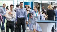 Candid photo of three students at the Career Factory event