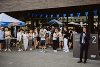 Students in front of campus building at event