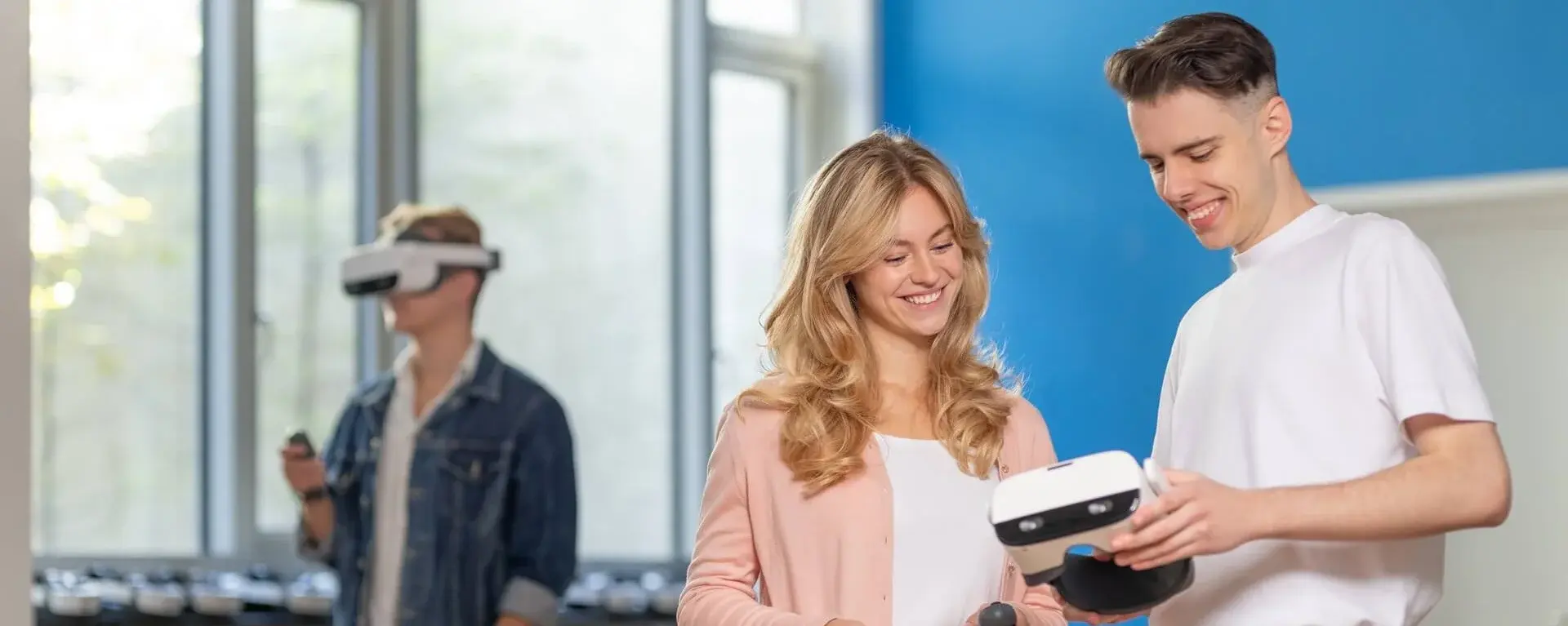 Two students looking at VR glasses