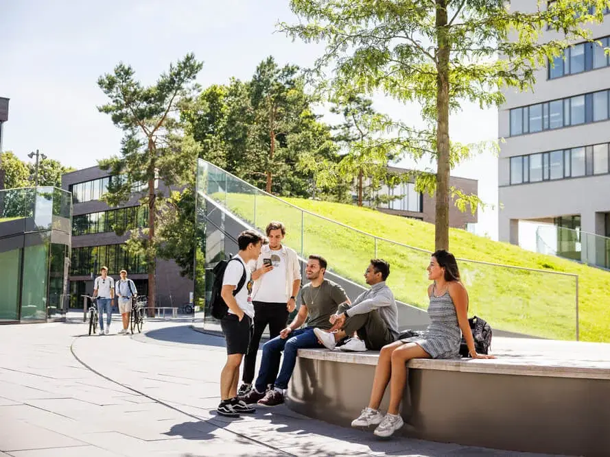 Students talking in front of campus mensa