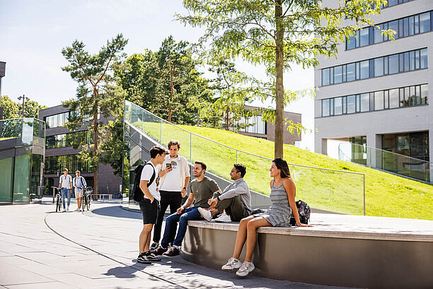 Students talking in front of campus mensa