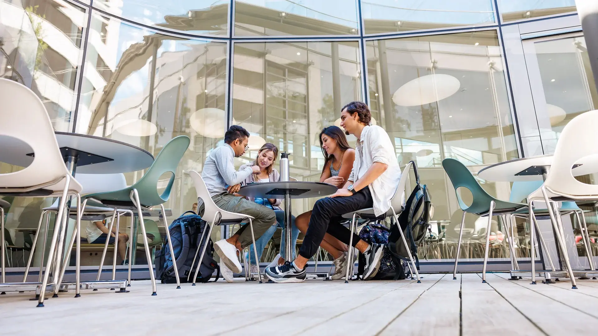 Four persons sitting at a table