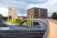 View of TUM Campus Heilbronn from the bridge at sunset